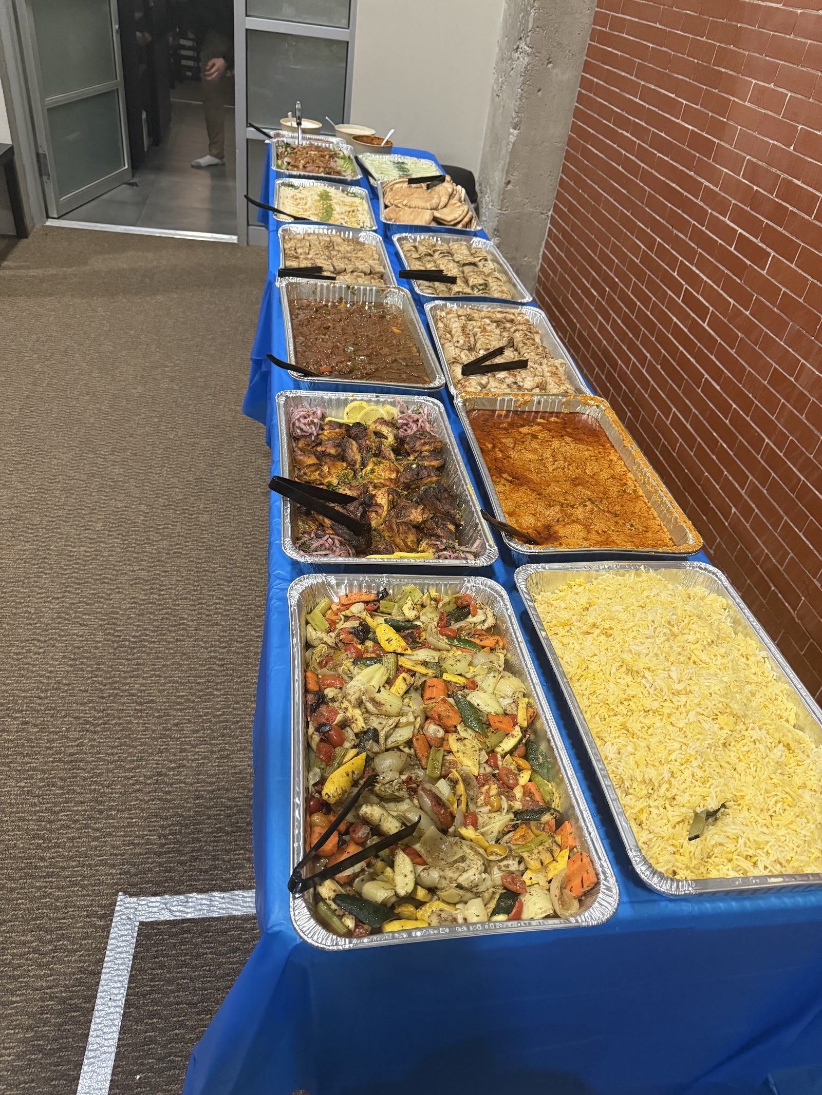 Catering buffet with smoked rice, grilled vegetables and grilled chicken
